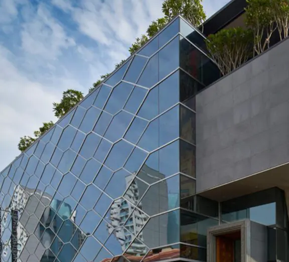 Indian Heritage Centre's modern glass facade in Singapore.