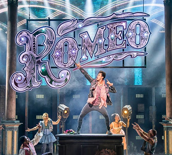 Stage performance of a modern Romeo show with actors in period costumes.