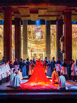 Opera performance at English National Opera with cast in elaborate costumes.
