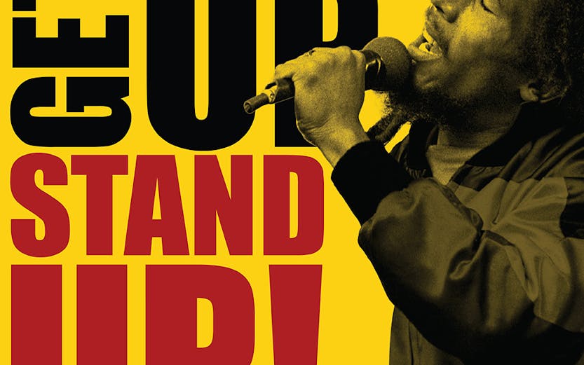 Performer singing passionately with 'Get Up Stand Up' text, True Story Shows