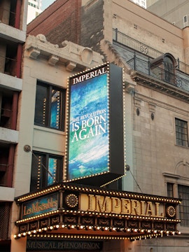 Imperial Theatre marquee displaying Les Misérables, a Tony Award-winning show in New York City.