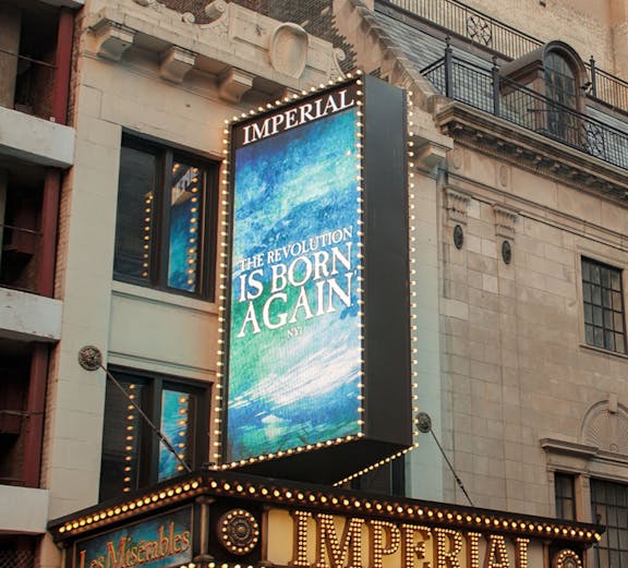 Imperial Theatre marquee displaying Les Misérables, a Tony Award-winning show in New York City.
