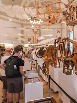 Visitors viewing Leonardo da Vinci's flying machine models at Leonardo3 Museum.