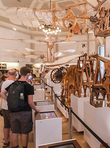 Visitors viewing Leonardo da Vinci's flying machine models at Leonardo3 Museum.