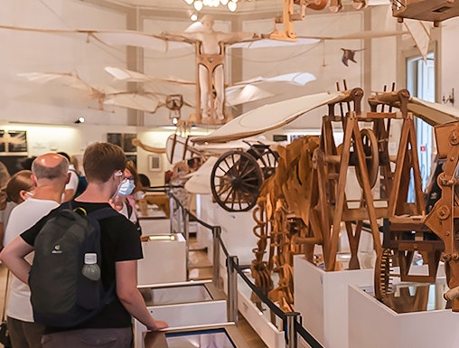 Visitors viewing Leonardo da Vinci's flying machine models at Leonardo3 Museum.