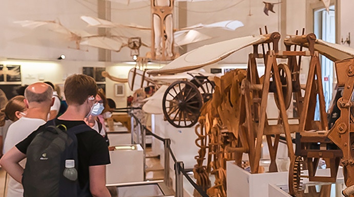 Visitors viewing Leonardo da Vinci's flying machine models at Leonardo3 Museum.