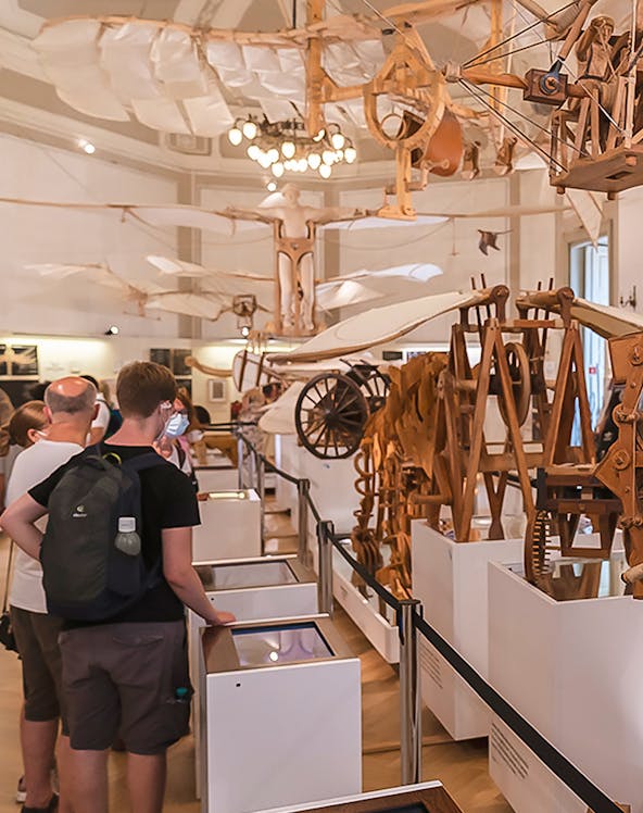Visitors viewing Leonardo da Vinci's flying machine models at Leonardo3 Museum.