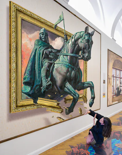Illusion Art Museum visitor interacts with 3D painting of a knight on horseback.