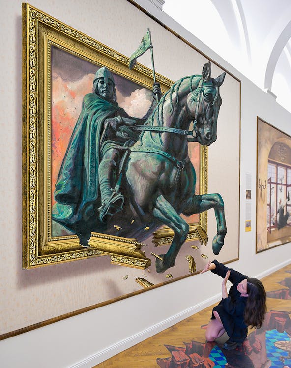 Illusion Art Museum visitor interacts with 3D painting of a knight on horseback.