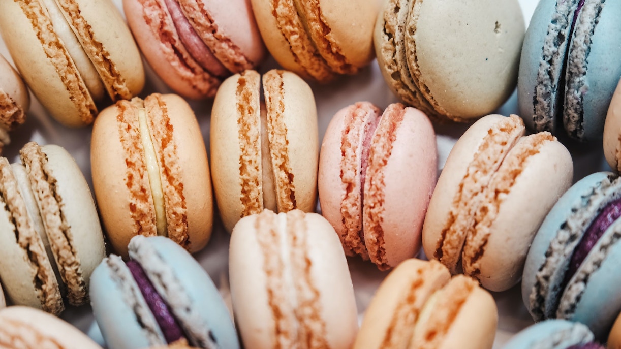 Colorful macarons arranged in a circle, Paris street food.