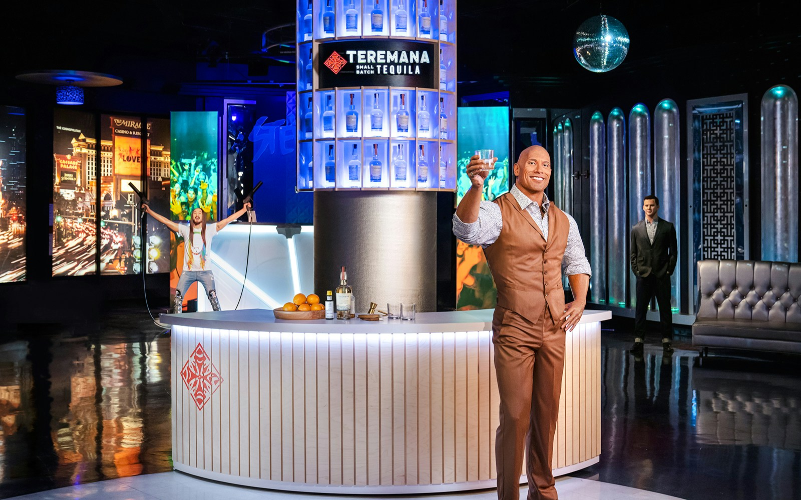 Dwayne Johnson statue holding a drink at Madame Tussauds Las Vegas.