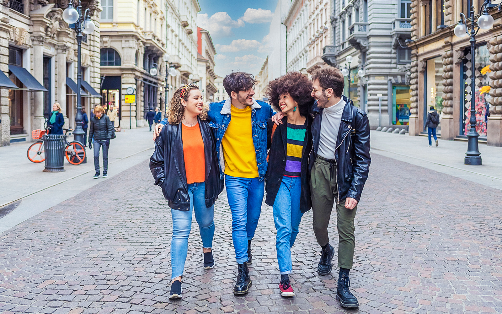Tourists walking on a street in Milan during a city tour.