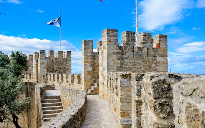 Walking path and stone towers of Castelo de Sao Jorge, Lisbon.