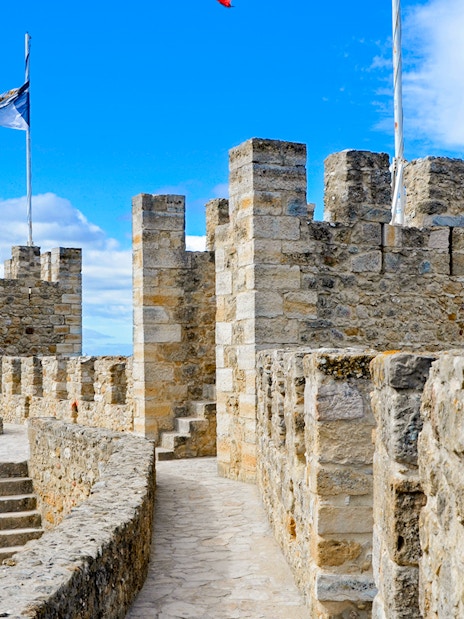 Walking path and stone towers of Castelo de Sao Jorge, Lisbon.