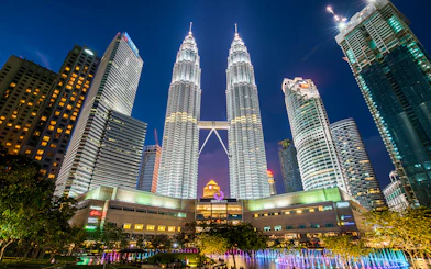 Petronas Twin Towers illuminated at night in Kuala Lumpur, Malaysia.