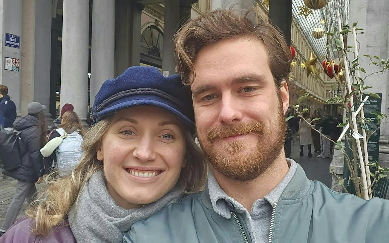 Couple exploring the Royal Gallery of Saint Hubert in Brussels during a self-guided city game.
