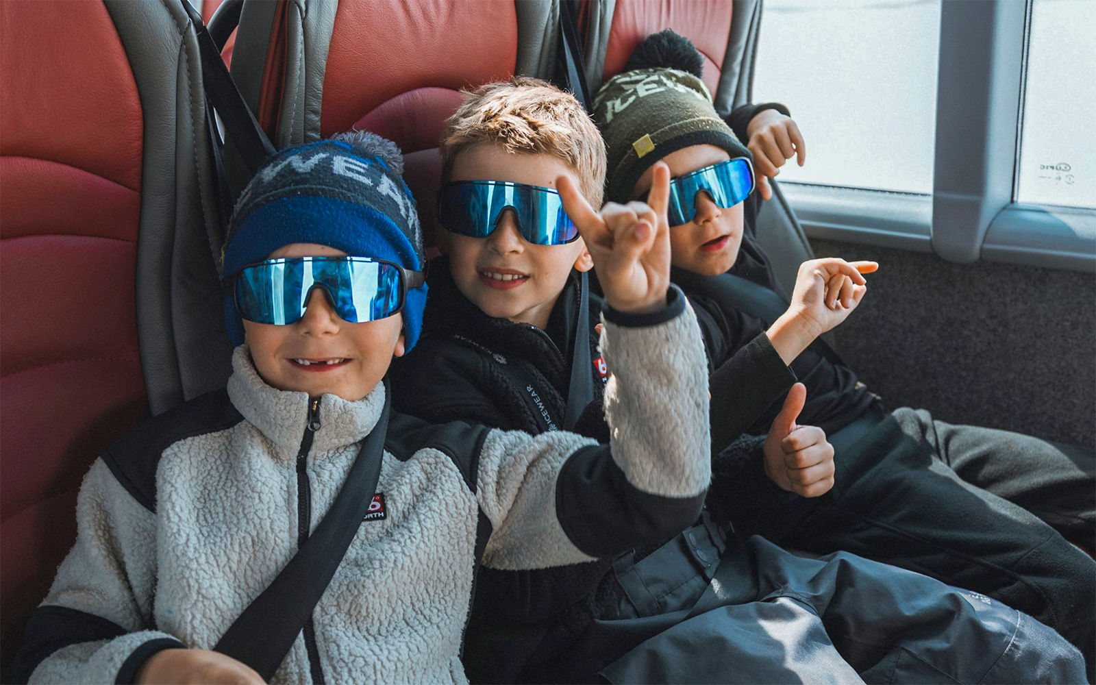 Kids enjoying Red Monster truck ride on Langjökull Glacier Tour from Gullfoss.