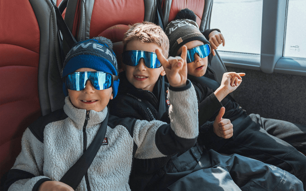 Kids enjoying Red Monster truck ride on Langjökull Glacier Tour from Gullfoss.