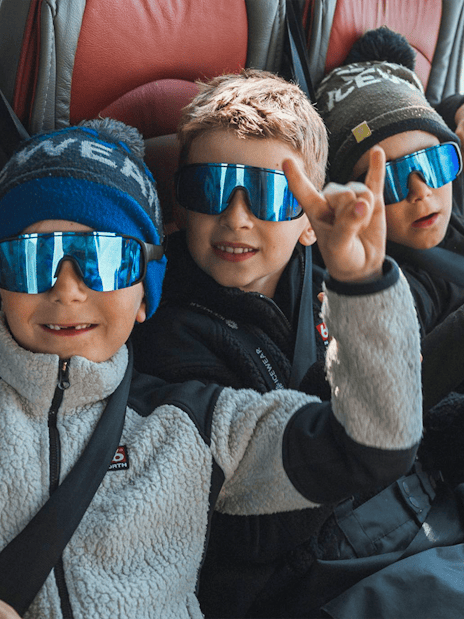 Kids enjoying Red Monster truck ride on Langjökull Glacier Tour from Gullfoss.