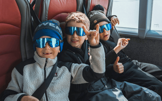 Kids enjoying Red Monster truck ride on Langjökull Glacier Tour from Gullfoss.