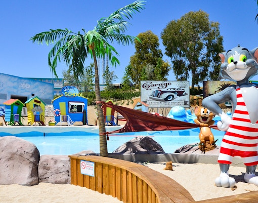 Parque Warner Beach water park with colorful slides and wave pool in Madrid, Spain.