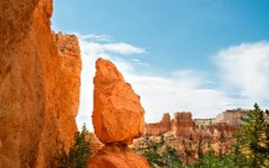 Bryce Canyon hoodoo rock formations under blue sky, part of Vegas Bryce & Zion tour.