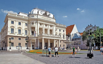Bratislava Opera House with tourists during walking tour.