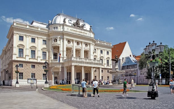 Bratislava Opera House with tourists during walking tour.