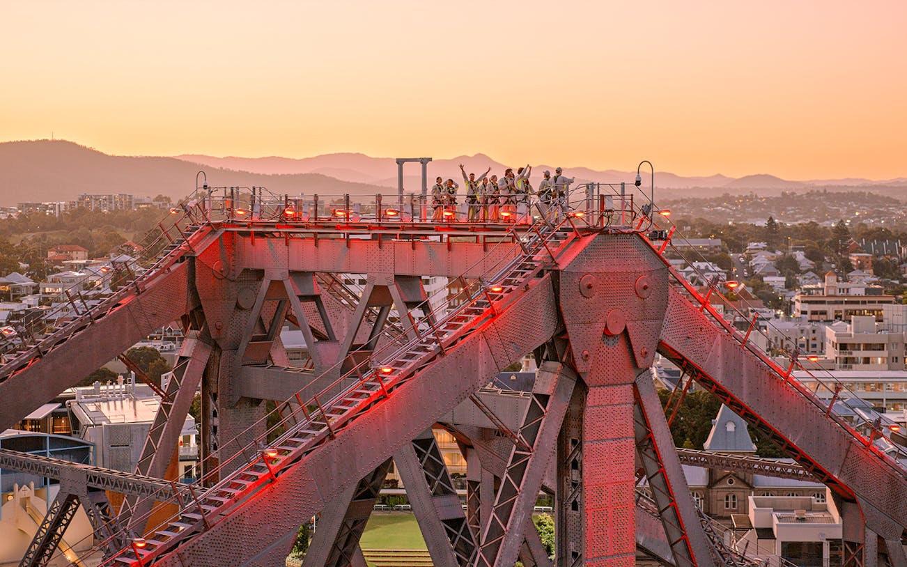 Climbers on Story Bridge during twilight in Brisbane, Australia.
