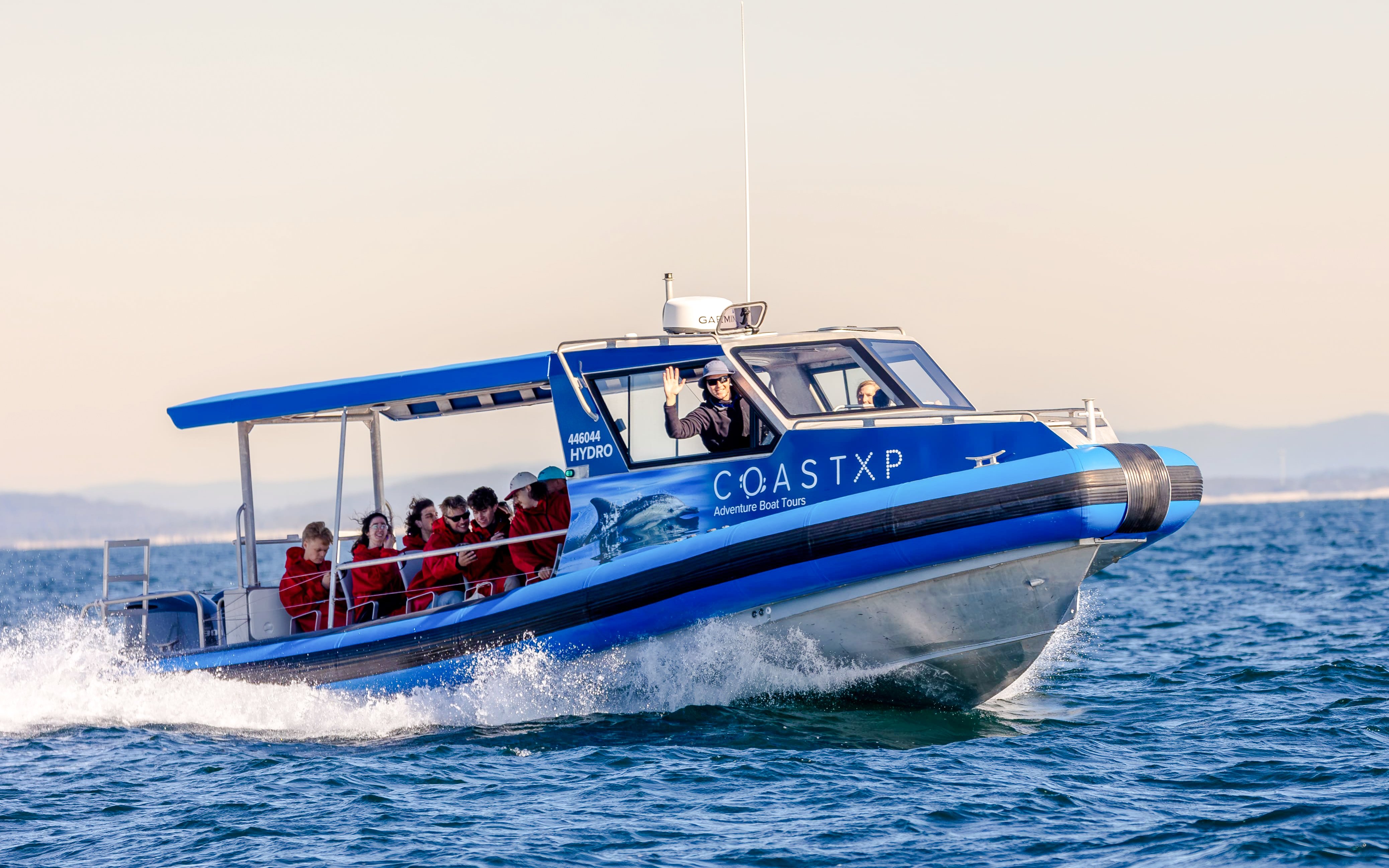 Boat with passengers on Lake Macquarie Coastal Tour, Australia.