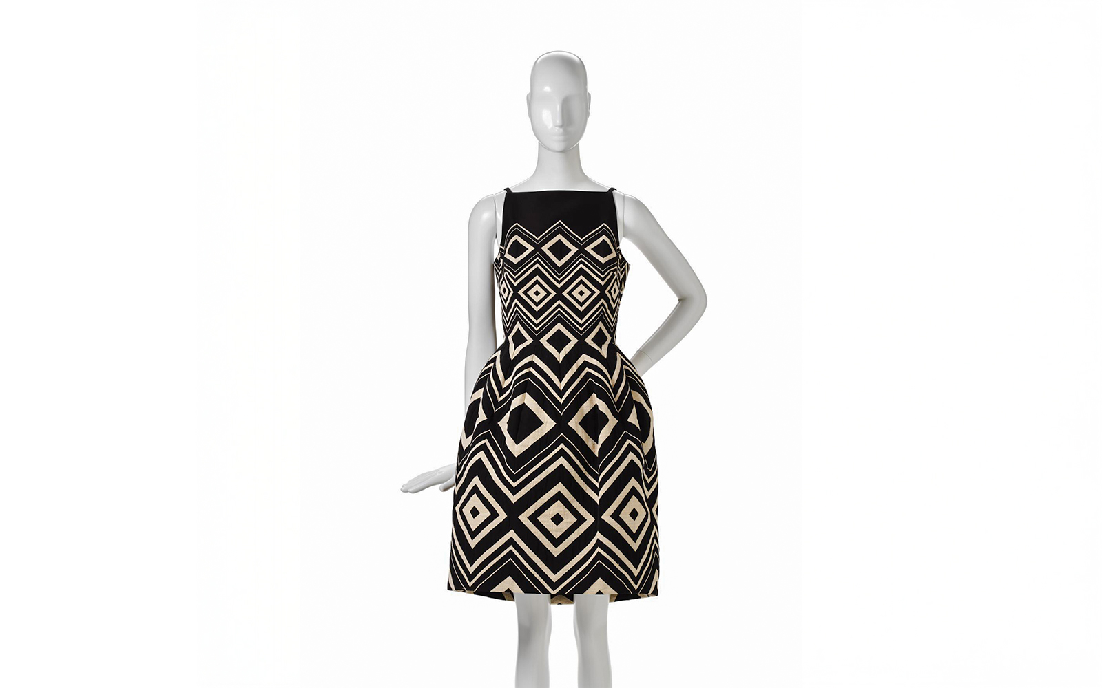 Mannequin wearing a geometric patterned dress at Martin Grant exhibition, National Gallery of Victoria.