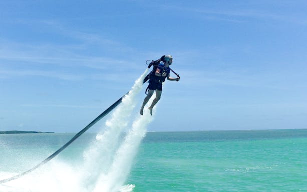 Jetpack rider soaring over the water at The Palm Jumeirah.