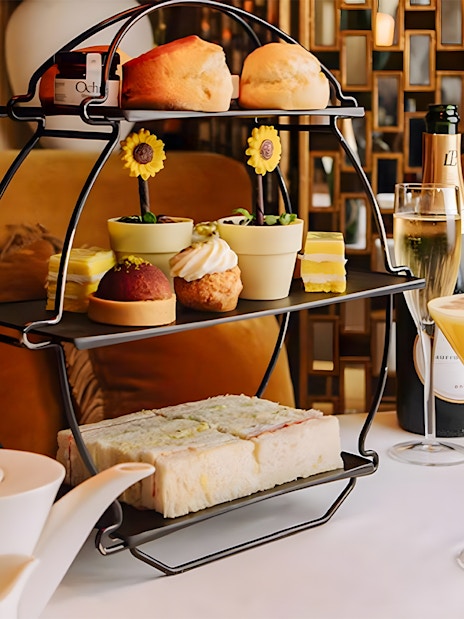 Afternoon tea set with pastries and sandwiches, part of National Gallery Guided Tour.