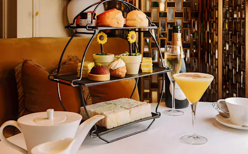 Afternoon tea set with pastries and sandwiches, part of National Gallery Guided Tour.