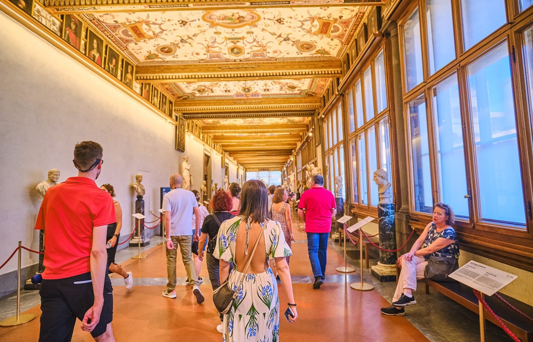 Vasari Corridor view with Uffizi Gallery artworks, Florence private tour.