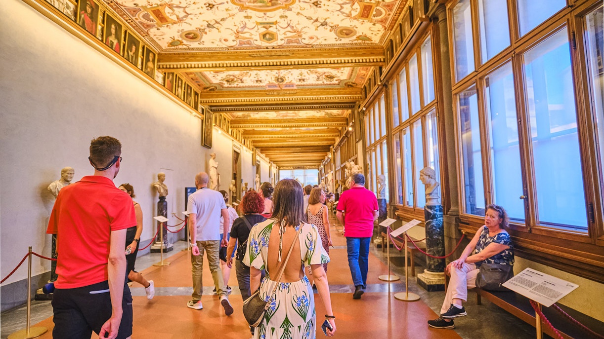 Vasari Corridor view with Uffizi Gallery artworks, Florence private tour.