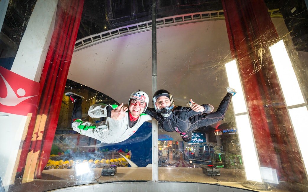 Person and instructor in iFly Dubai indoor skydive experience.