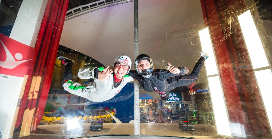 Person and instructor in iFly Dubai indoor skydive experience.