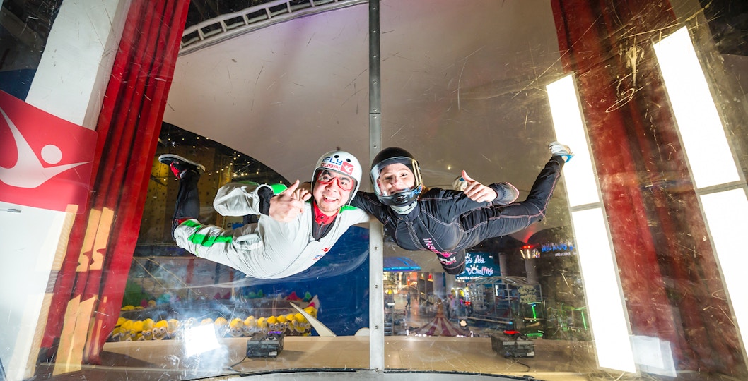 Person and instructor in iFly Dubai indoor skydive experience.