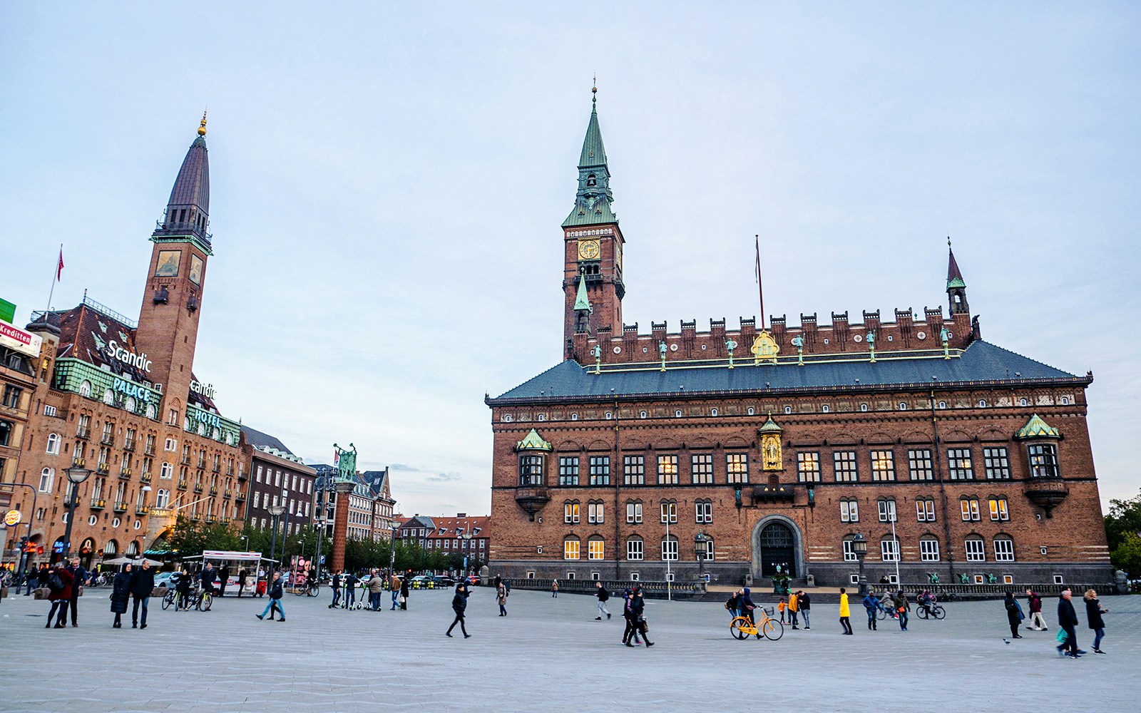 Rådhuspladsen with Copenhagen City Hall and people walking.