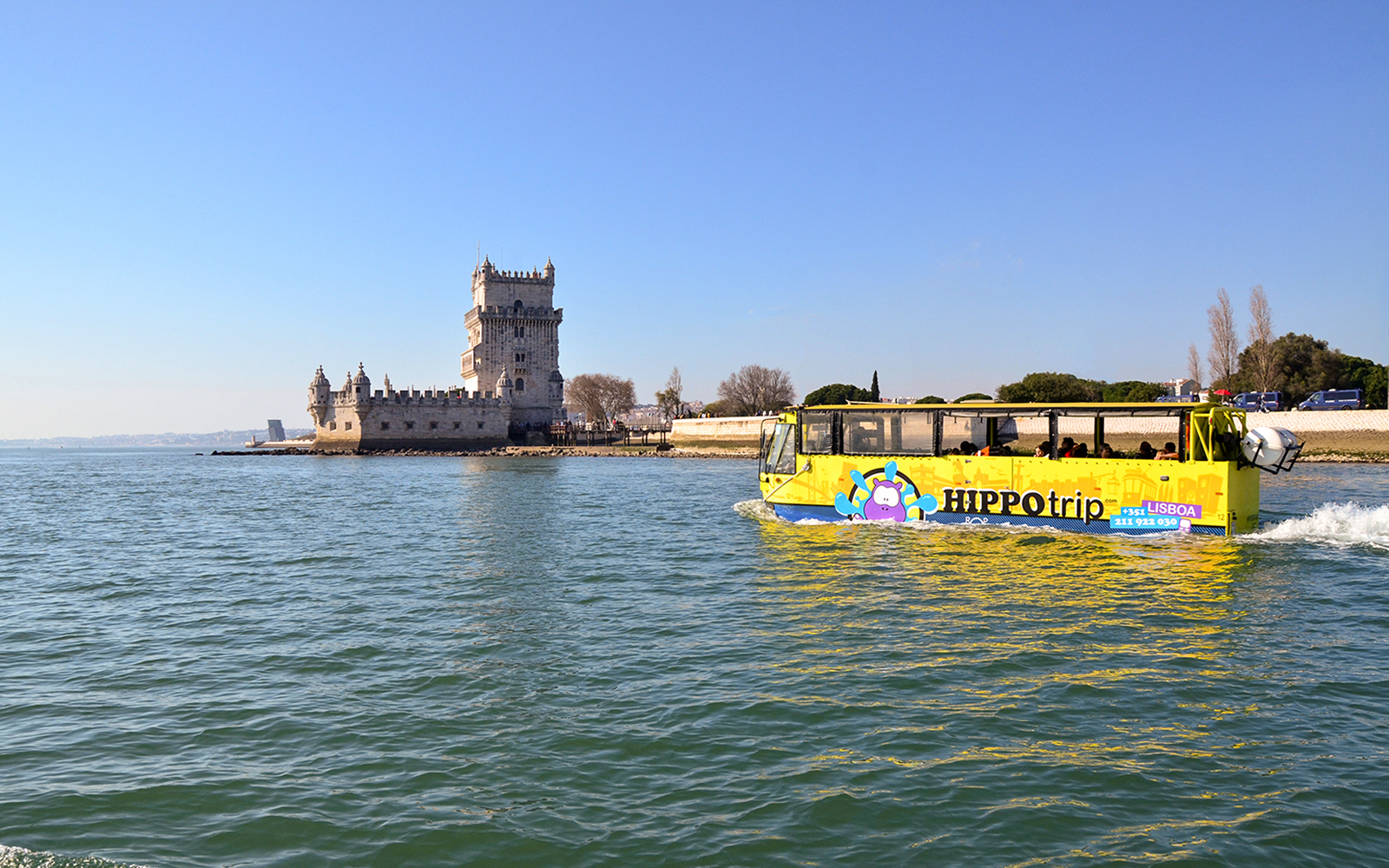 Amphibious tour bus near Belém Tower on Lisbon sightseeing guided tour.