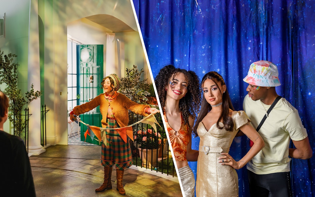 Performer in colorful attire at an indoor event; group posing against a starry backdrop.