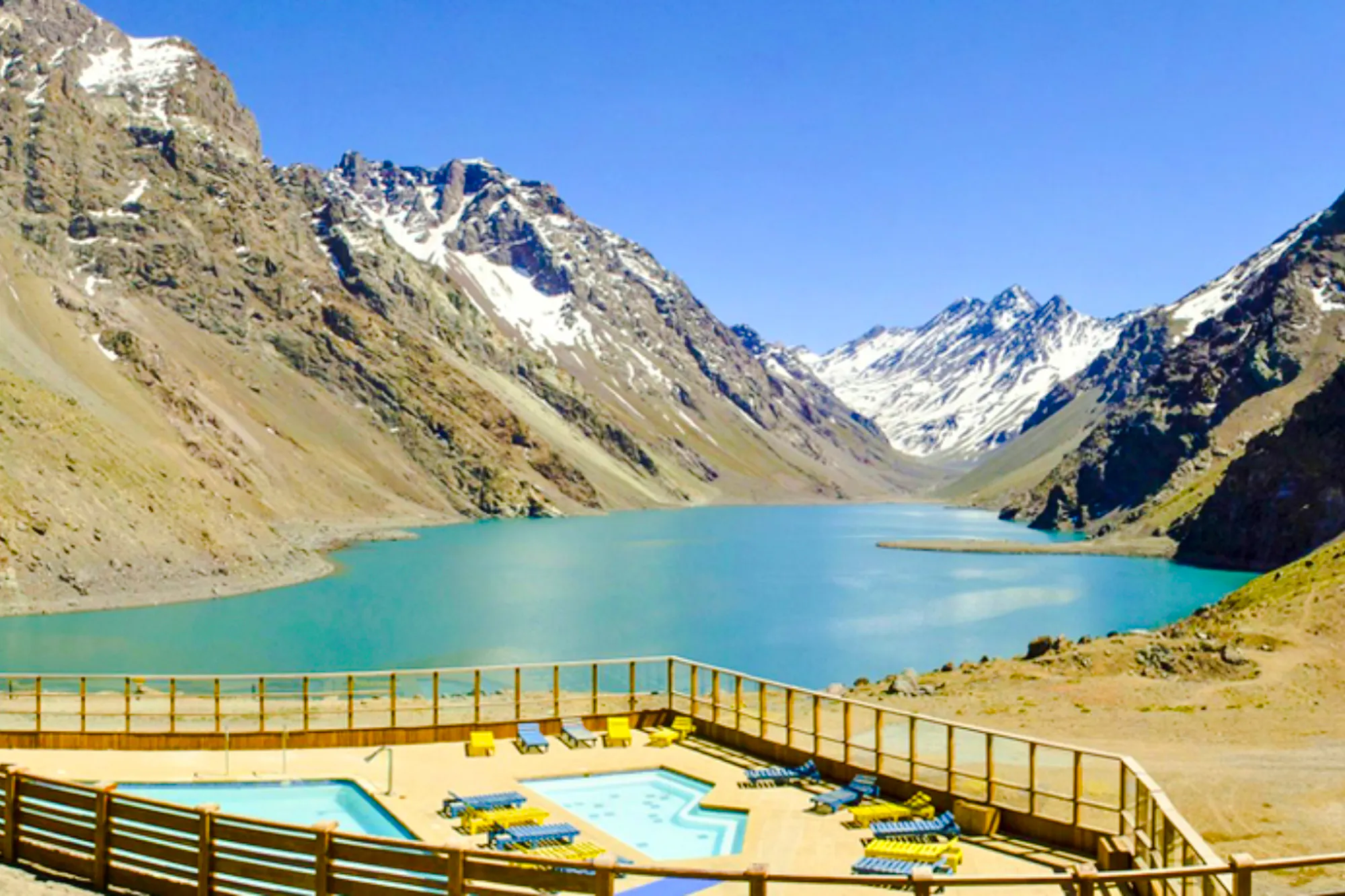 Laguna del Inca with poolside view at Hotel Portillo, surrounded by Andes mountains, Santiago.