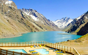 Laguna del Inca with poolside view at Hotel Portillo, surrounded by Andes mountains, Santiago.