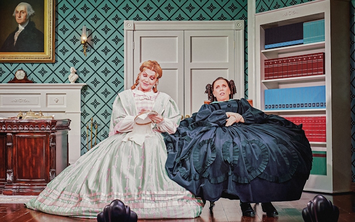 Stage scene from Oh, Mary Westend show with two actors in period costumes.