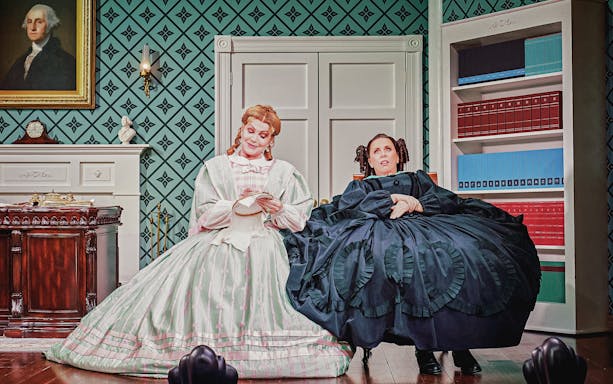 Stage scene from Oh, Mary Westend show with two actors in period costumes.