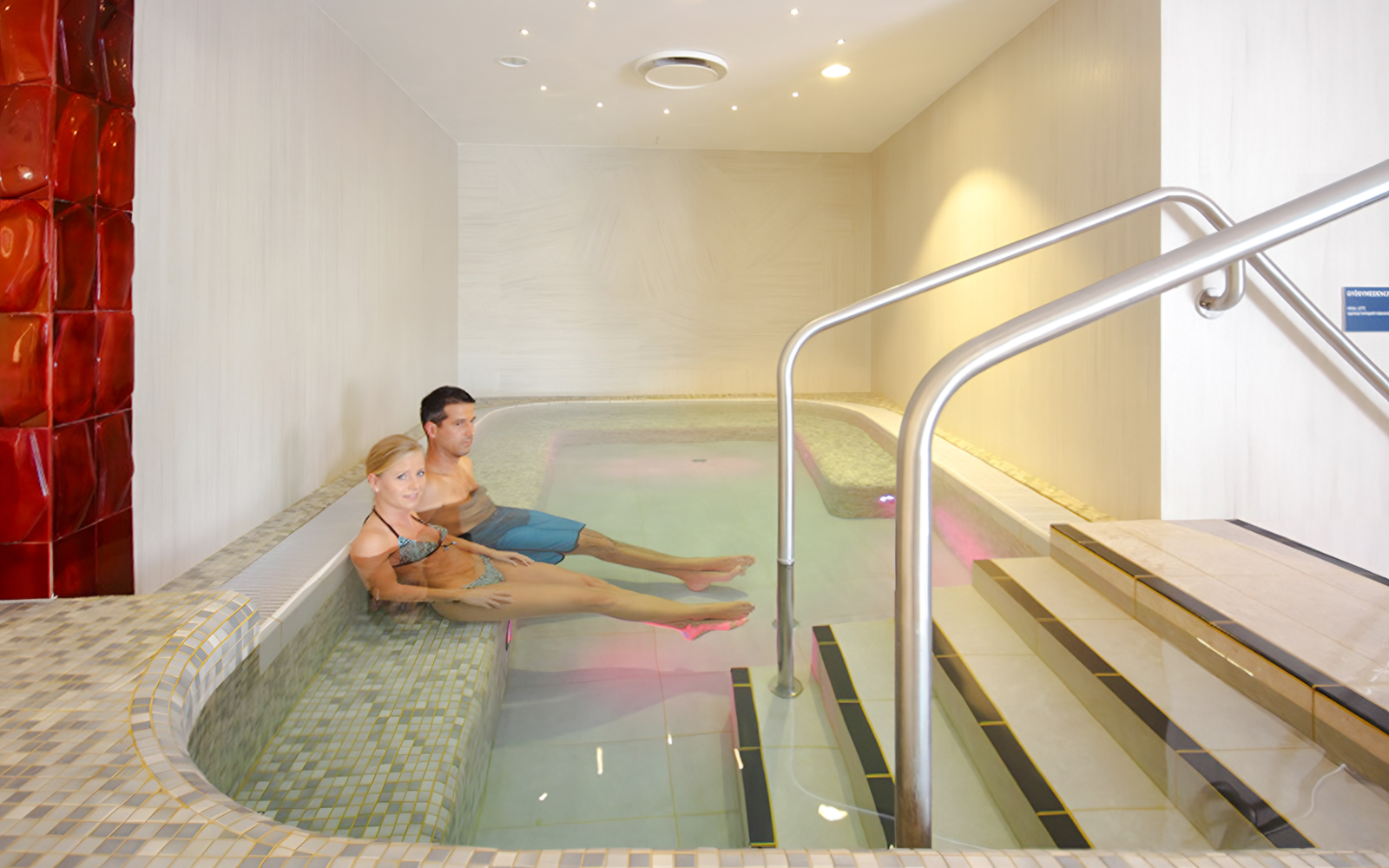 Couple relaxing in the indoor pool at Rudas Bath, Budapest.