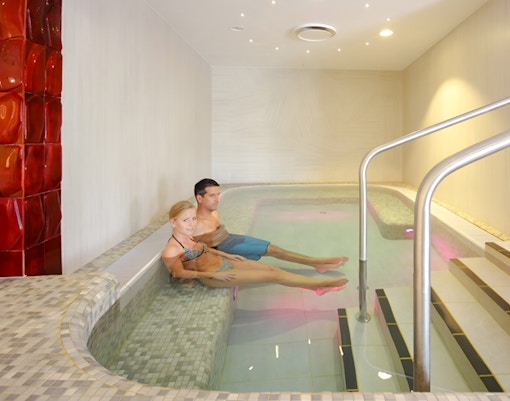 Couple relaxing in the indoor pool at Rudas Bath, Budapest.