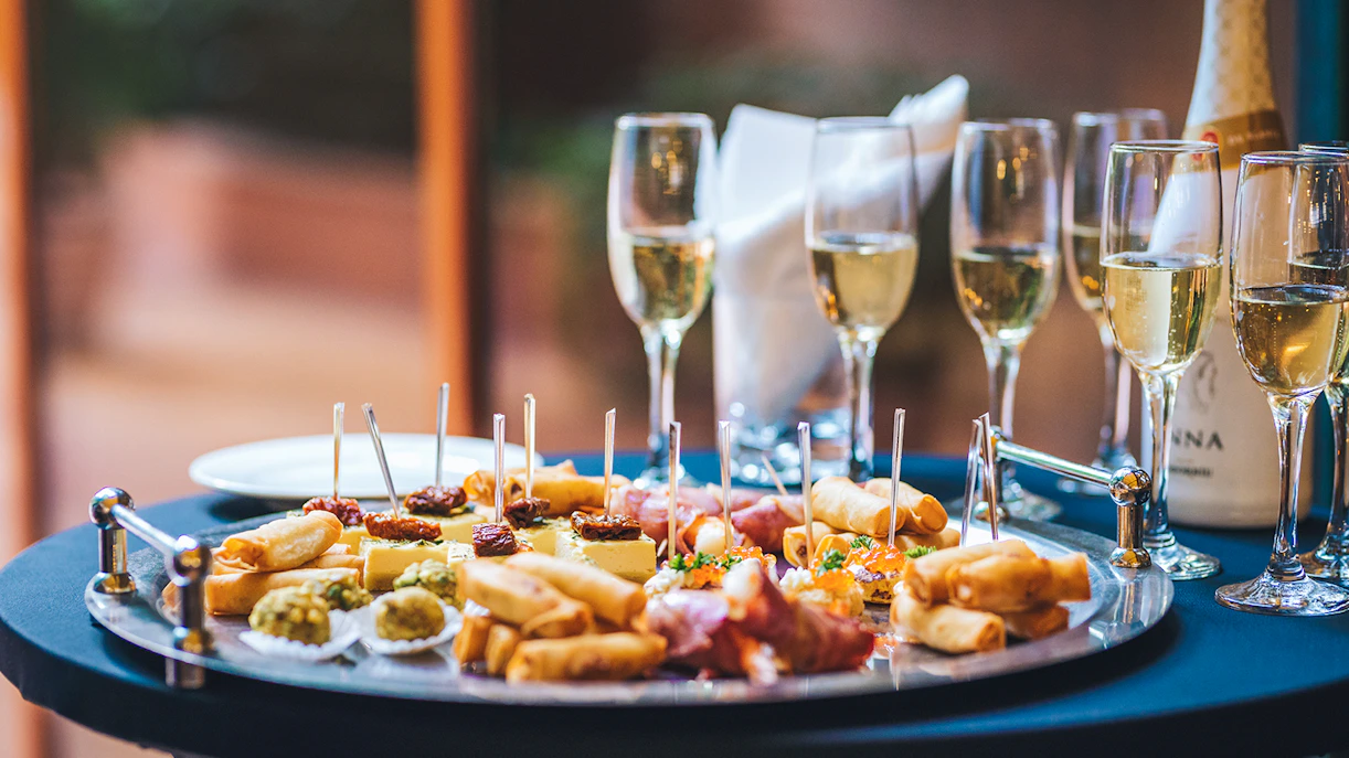 Canapes and champagne on a table during Sydney New Year's Eve dinner cruise.