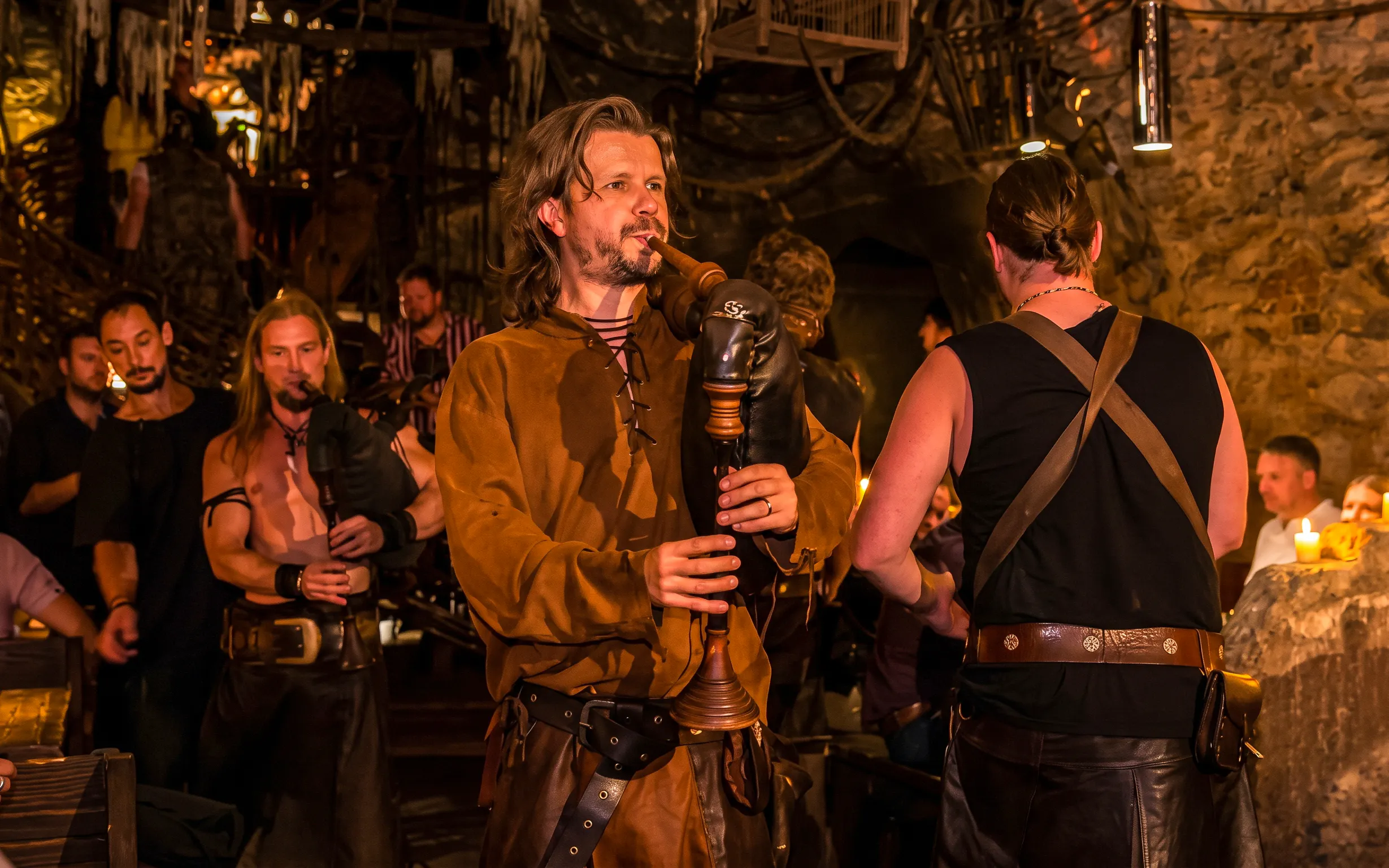 Musicians playing bagpipes at a Medieval Dinner Show in Prague.